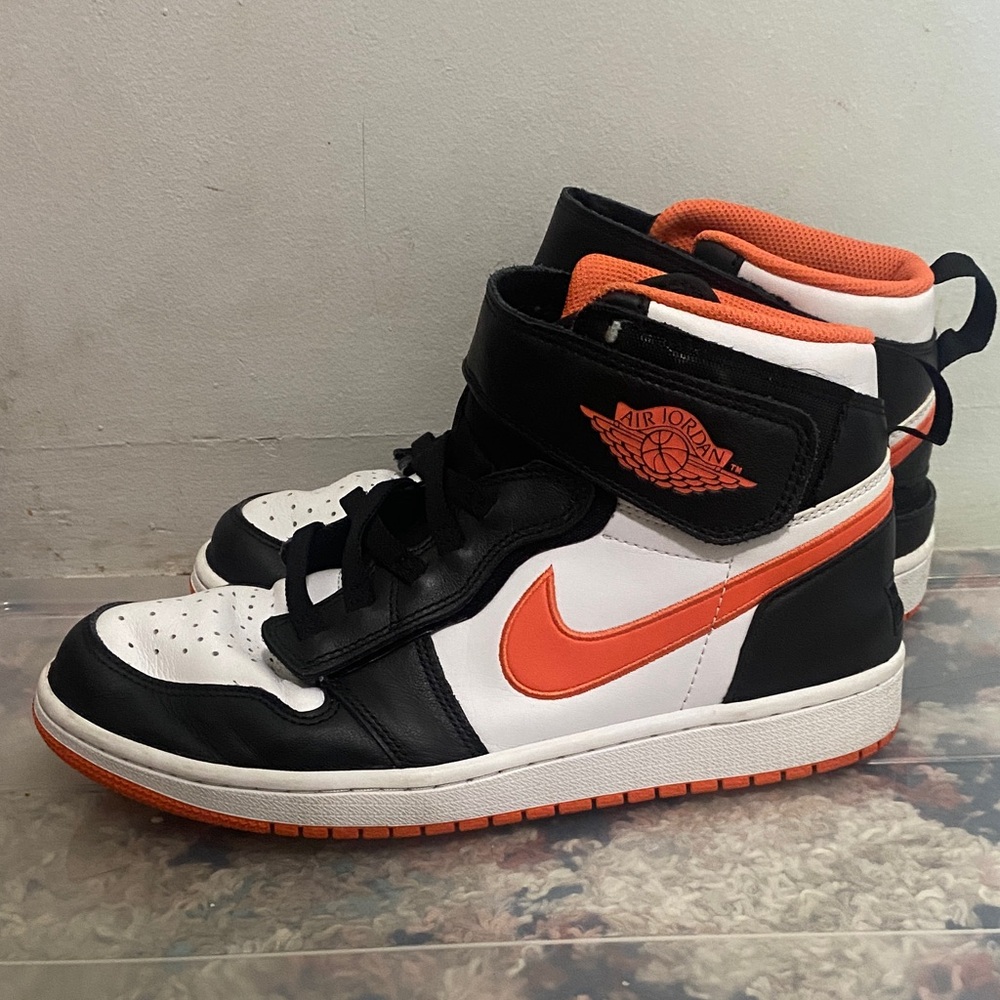 Used Air Jordan Size Women’s 8.5 Black and Orange High-Top Sneakers